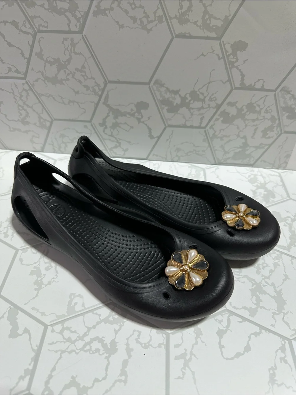 CROCS Black Women's Slip-On Flats with Gold Floral Charms